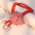 Mesh flower necklace with red cord and pearls displayed on white geometric stands - Pink Double Pearl Style (X-694)