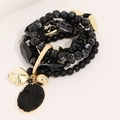 Bracciale bohémien multistrato con perline nere e ciondoli dorati eleganti - Nero (S-445)