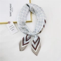 Light blue geometric silk scarf featuring vintage circular patterns and tied knot design - Light Blue Double Row Grid