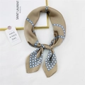 Elegant champagne silk scarf with blue pearl chain pattern tied in a stylish bow knot - Earthy Yellow Steel Bead Chain