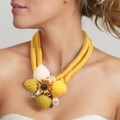 Exaggerated braided necklace with crochet flowers and sunflower pendant on model - Sunflower Metal Piece Yellow Green Braided (X-670)