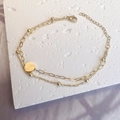 Detail of double-layer stainless steel bracelet with round pendant and bead chain - Gold-Round