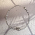 Macro view of double-layered silver butterfly chain with beads and lobster clasp detail - Silver-Butterfly