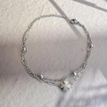 Detail view of double-layer stainless steel bracelet featuring a four-leaf clover charm - Silver-Clover