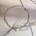 Detail view of double-layered stainless steel chain bracelet with round charm and beads - Silver-Round