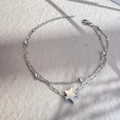 Detail of silver double-layered star bracelet with paperclip chain and lobster clasp - Silver - Stars