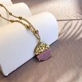 Detail of a geometric pendant necklace with hammered gold texture and purple marble stone - Gold-Rhodochrosite