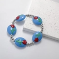 Braccialetto con perline a tulipano blu e fiori dipinti a mano su base in pietra bianca - Blu scuro