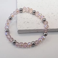 Close-up of 6mm pink faceted crystal beads and silver steel spheres on stretch bracelet - Pink-Steel
