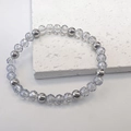 Detailed close-up of 6mm clear crystal and silver metal beaded elastic stretch bracelet - Gray-Steel