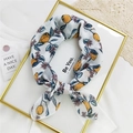 Floral cotton linen square scarf with yellow lemon print in a lifestyle setting - White Lemon