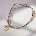 Detail of leopard print fabric cord and gold flower pendant with sparkling center zircon - Flower with Zirconia Style (DN299-P278)