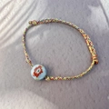 Pulsera bohemia trenzada a mano con cuenta de cerámica floral y nudo ajustable artesanal - Azul