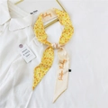 Narrow yellow floral silk scarf tied as a bow on white shirt collar with positive text - 33K Five-petal Orange Flower / 6*135cm