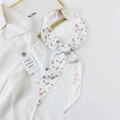 White narrow silk twilly scarf with pink floral prints and Positive Thinking slogan - 28K Round Fruit / 6*135cm