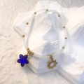 Detail of white frosted beads bracelet with gold sun charm and blue star stone pendant - White - Royal Blue Star