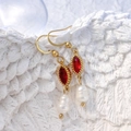 Détail des boucles d'oreilles perles en forme de goutte avec zircon rouge et or - Ovale Rouge