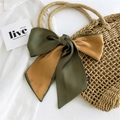 Two-tone dark green and yellow satin silk scarf bow tied on a woven straw bag - Yellow and Green