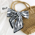 Zebra pattern silk scarf tied in a bow on a straw bag handle, black and white color - Black White Zebra