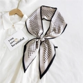 Long skinny silk scarf with geometric paisley patterns tied on a white shirt collar - Beige Paisley Grid (12)