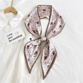 Pink paisley silk-like skinny scarf tied in a bow over a white shirt collar - Pink Paisley Lily (15)