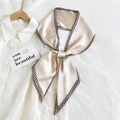 Beige skinny silk scarf with houndstooth edge tied as a bow on a white shirt collar - Beige Houndstooth Edge (8)