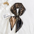 Slim khaki tiger print silk scarf with brand letters tied on a white shirt collar - Camel Zebra HILLDI (27)
