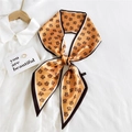 Orange vintage pattern narrow silk scarf styled as a bow on a white shirt collar - TM Orange (18)