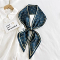 Navy blue silk skinny scarf with gold monogram pattern tied in a bow on a white shirt - TM Navy Blue (19)