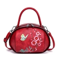 Rode retro handtas met prachtig borduurwerk van bloemen en vlinders en leerstructuur - Rood