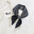 Striped navy blue and white narrow silk twilly scarf tied in a bow on a white shirt - Navy Blue White Stripe