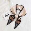 Champagne slim silk scarf with palm leaf and dog print tied on a minimalist white background - Champagne Palm Silhouette