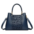 Dark blue floral embossed crossbody handbag with golden hardware and shoulder strap - Blue