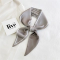 Elegant grey narrow silk scarf with letter print styled on a white shirt - Gray Letter Texture