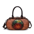 Vintage brown leather cylinder bag featuring a three-dimensional floral relief carving - Brown