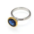 Elegant silver and gold-toned ring featuring a brilliant round-cut blue cubic zirconia stone - Two-tone Gold Dark Blue Rhinestone