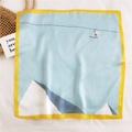 Artistic square silk scarf in light blue with yellow borders and geometric mountain print - Leap Over Pyramids