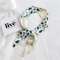 Off-white narrow silk scarf with green avocado print styled on a white shirt - Dark Green Avocado Style (19K Avocado Dark Green)