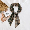 Green and brown checkered silk twilly scarf tied in a bow on a stylish straw bag - Double Plaid Green