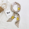Beige narrow silk scarf with yellow cartoon print on white cotton shirt background - Yellow Cartoon Creature