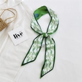 Silk twilly scarf featuring green cactus patterns and deep blue edge on white linen - Cactus Green