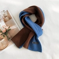Two-tone caramel brown and bright blue knitted scarf with smile leather patch detail - Caramel & Blue