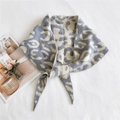 Knitted leopard print triangle scarf in grey and beige tones for winter warmth - Gray