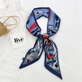 Narrow silk twilly scarf in navy blue with equestrian prints tied on a wicker handbag - 15L Chain Belt Blue