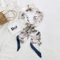 Elegant off-white narrow silk scarf with navy horse print tied on a straw handbag - 24L Western Horse Beige