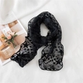 Elegant black lace skinny scarf with star patterns on white textured fabric background - Black
