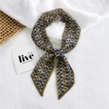 Olive green narrow silk scarf with blue floral pattern styled on woven texture mat - Chiffon Autumn Leaves Yellow