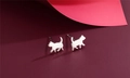 Macro shot of silver cat silhouette earrings featuring a unique brushed metal texture - Cat Silhouette Style (F4)