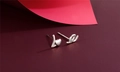 Close-up of S925 silver stud earrings with L and E letter charms and heart detail - Love Letter Heart (F17)