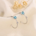 Elegant silver moonstone hoop earrings with blue gemstones on minimalist background - Light Blue (A48)